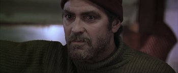 Movie still from “The Perfect Storm” (2000), directed by Wolfgang Petersen – A person with a beard wearing a hat; Close Up shot, Low angle
