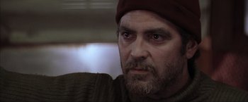 Movie still from “The Perfect Storm” (2000), directed by Wolfgang Petersen – A person with a beard wearing a hat; Close Up shot, Low angle