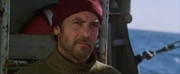 Movie still from “The Perfect Storm” (2000), directed by Wolfgang Petersen – A person wearing a hat; Close Up shot, Low angle