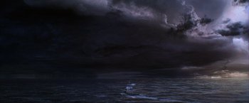 Movie still from “The Perfect Storm” (2000), directed by Wolfgang Petersen – A dark sky over a body of water; Extreme Wide shot, High angle