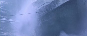 Movie still from “The Perfect Storm” (2000), directed by Wolfgang Petersen – A boat in the water during a rainy day; Wide shot, Low angle