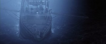 Movie still from “The Perfect Storm” (2000), directed by Wolfgang Petersen – A boat in the middle of the ocean on a foggy day; Extreme Wide shot, Overhead angle