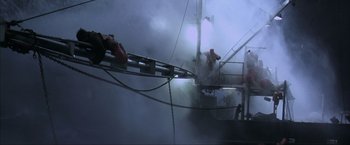 Movie still from “The Perfect Storm” (2000), directed by Wolfgang Petersen – Two people jumping off a boat in the fog; Wide shot, High angle