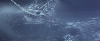 Movie still from “The Perfect Storm” (2000), directed by Wolfgang Petersen – A boat in the water in the middle of the night; Extreme Wide shot, High angle