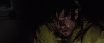 Movie still from “The Perfect Storm” (2000), directed by Wolfgang Petersen – A person wearing a raincoat; Close Up shot, Low angle