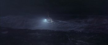 Movie still from “The Perfect Storm” (2000), directed by Wolfgang Petersen – A boat in the middle of the ocean at night; Extreme Wide shot, High angle