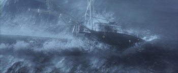Movie still from “The Perfect Storm” (2000), directed by Wolfgang Petersen – A boat in the water in the middle of the night; Extreme Wide shot, High angle