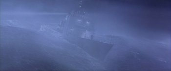 Movie still from “The Perfect Storm” (2000), directed by Wolfgang Petersen – A ship in the middle of the ocean on a foggy night; Extreme Wide shot, High angle