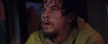 Movie still from “The Perfect Storm” (2000), directed by Wolfgang Petersen – A person wearing a yellow jacket; Close Up shot, Low angle