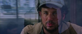 Movie still from “The Perfect Storm” (2000), directed by Wolfgang Petersen – A person wearing a hat; Close Up shot, Low angle