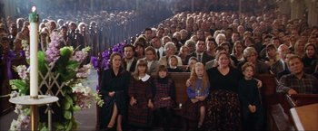 Movie still from “The Perfect Storm” (2000), directed by Wolfgang Petersen – A large group of people sitting in front of an audience; Wide shot, High angle