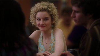 Movie still from “The Perks of Being a Wallflower” (2012), directed by Stephen Chbosky – A woman with blonde curly hair sitting at a table; Close Up shot, Over the shoulder angle