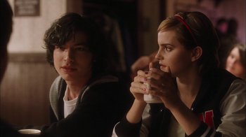 Movie still from “The Perks of Being a Wallflower” (2012), directed by Stephen Chbosky – A man and a woman sitting next to each other; Medium shot, Over the shoulder angle