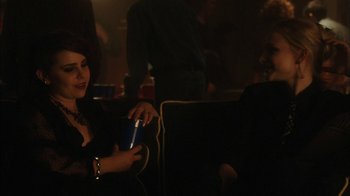Movie still from “The Perks of Being a Wallflower” (2012), directed by Stephen Chbosky – A woman sitting in a chair holding a cup; Medium shot, Over the shoulder angle