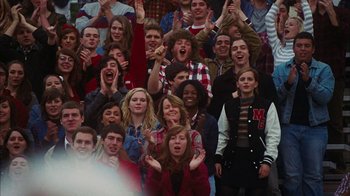 Movie still from “The Perks of Being a Wallflower” (2012), directed by Stephen Chbosky – A group of people that are standing in a crowd; Medium shot, High angle