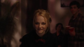 Movie still from “The Perks of Being a Wallflower” (2012), directed by Stephen Chbosky – A woman with blonde hair wearing a black shirt; Close Up shot, Over the shoulder angle