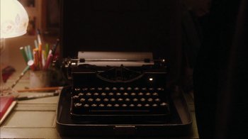 Movie still from “The Perks of Being a Wallflower” (2012), directed by Stephen Chbosky – An old fashioned typewriter sitting on top of a desk; Extreme Close Up shot, Overhead angle