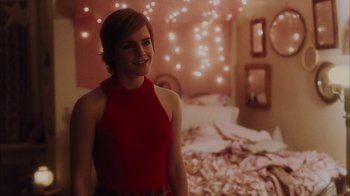 Movie still from “The Perks of Being a Wallflower” (2012), directed by Stephen Chbosky – A woman in a red top standing in a bedroom; Medium shot, Over the shoulder angle