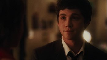 Movie still from “The Perks of Being a Wallflower” (2012), directed by Stephen Chbosky – A man in a suit and tie looking at the camera; Close Up shot, Over the shoulder angle