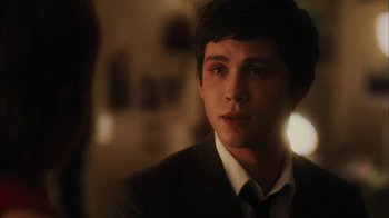 Movie still from “The Perks of Being a Wallflower” (2012), directed by Stephen Chbosky – A man in a suit and tie looking at the camera; Close Up shot, Over the shoulder angle