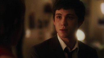 Movie still from “The Perks of Being a Wallflower” (2012), directed by Stephen Chbosky – A man in a suit and tie looking at the camera; Close Up shot, Over the shoulder angle