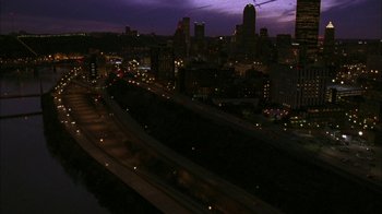 Movie still from “The Perks of Being a Wallflower” (2012), directed by Stephen Chbosky – A view of a city at night from a helicopter; Extreme Wide shot, High angle