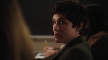 Movie still from “The Perks of Being a Wallflower” (2012), directed by Stephen Chbosky – A man in a suit and tie holding a lit candle; Close Up shot, Over the shoulder angle