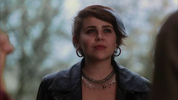 Movie still from “The Perks of Being a Wallflower” (2012), directed by Stephen Chbosky – A person with short hair wearing a necklace; Close Up shot, Low angle