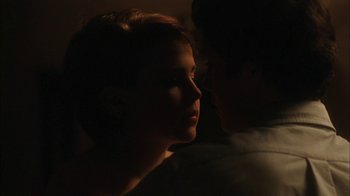 Movie still from “The Perks of Being a Wallflower” (2012), directed by Stephen Chbosky – A man and a woman in the dark with their faces lit up; Close Up shot, Over the shoulder angle