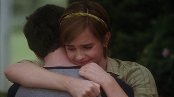 Movie still from “The Perks of Being a Wallflower” (2012), directed by Stephen Chbosky – A woman is hugging a man while they both look at each other; Close Up shot, Over the shoulder angle