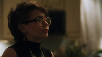 Movie still from “The Perks of Being a Wallflower” (2012), directed by Stephen Chbosky – A woman wearing glasses and a black top; Close Up shot, Over the shoulder angle