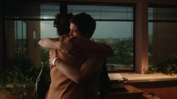 Movie still from “The Perks of Being a Wallflower” (2012), directed by Stephen Chbosky – Two people hugging in front of a window; Medium shot, Over the shoulder angle