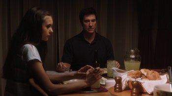 Movie still from “The Perks of Being a Wallflower” (2012), directed by Stephen Chbosky – A man and a woman sitting at a dinner table; Medium shot, Over the shoulder angle