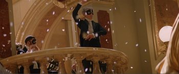 Movie still from “The Phantom of the Opera” (2004), directed by Joel Schumacher – A man in a black suit and a white mask; Wide shot, Low angle