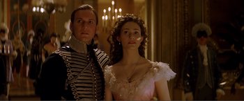 Movie still from “The Phantom of the Opera” (2004), directed by Joel Schumacher – A man and a woman standing next to each other; Close Up shot, Low angle