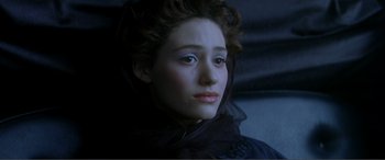 Movie still from “The Phantom of the Opera” (2004), directed by Joel Schumacher – A person wearing a dress; Close Up shot, High angle