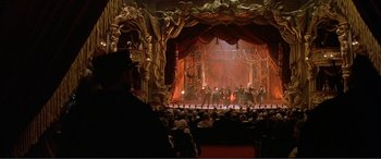 Movie still from “The Phantom of the Opera” (2004), directed by Joel Schumacher – A large crowd of people in a theater; Extreme Wide shot, High angle
