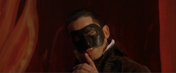Movie still from “The Phantom of the Opera” (2004), directed by Joel Schumacher – A man with a black mask on his face; Close Up shot, High angle