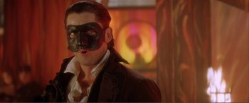 Movie still from “The Phantom of the Opera” (2004), directed by Joel Schumacher – A person wearing a mask; Close Up shot, Low angle
