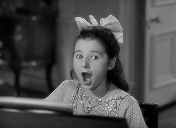 Movie still from “The Philadelphia Story” (1940), directed by George Cukor – A young girl with her mouth wide open; Close Up shot, High angle