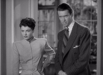 Movie still from “The Philadelphia Story” (1940), directed by George Cukor – A man and a woman standing next to each other; Medium shot, High angle