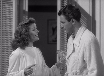 Movie still from “The Philadelphia Story” (1940), directed by George Cukor – A man and a woman are talking to each other; Medium shot, Over the shoulder angle