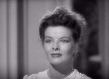 Movie still from “The Philadelphia Story” (1940), directed by George Cukor – An old photo of a woman in a white shirt; Close Up shot, High angle