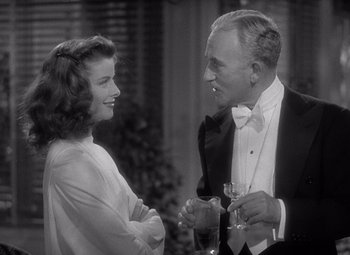 Movie still from “The Philadelphia Story” (1940), directed by George Cukor – An older man and a young woman talking to each other; Medium shot, Over the shoulder angle