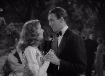 Movie still from “The Philadelphia Story” (1940), directed by George Cukor – A man and a woman are dancing in a black and white photo; Medium shot, Low angle