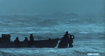 Movie still from “The Piano” (1993), directed by Jane Campion – A group of people on a boat in the ocean; Extreme Wide shot, High angle