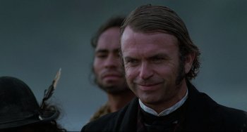Movie still from “The Piano” (1993), directed by Jane Campion – A person wearing a suit and tie; Close Up shot, Over the shoulder angle