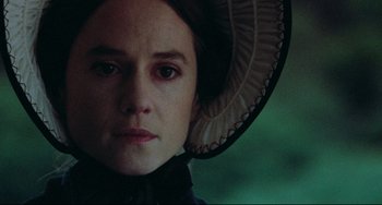 Movie still from “The Piano” (1993), directed by Jane Campion – A person wearing a hat; Close Up shot, Over the shoulder angle