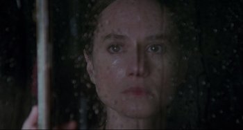 Movie still from “The Piano” (1993), directed by Jane Campion – A woman's face through a window; Close Up shot, Over the shoulder angle