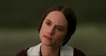 Movie still from “The Piano” (1993), directed by Jane Campion – A person wearing a dress; Close Up shot, Over the shoulder angle
